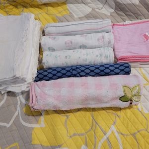 Baby blanket, cloth diapers, and burp clothes